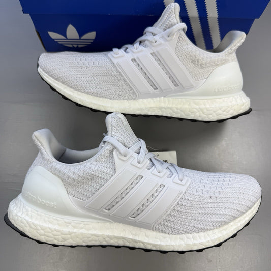 Adidas Ultra Boost 4.0 DNA white running trainers with mesh upper and signature three stripes.