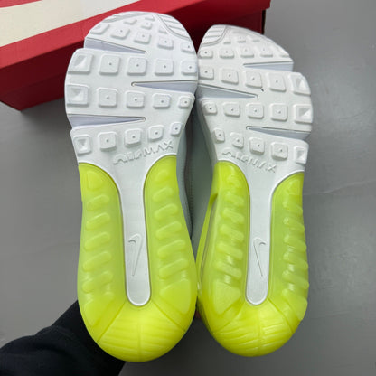 Nike white trainers with aquamarine and lime glow accents, featuring iconic logo details.