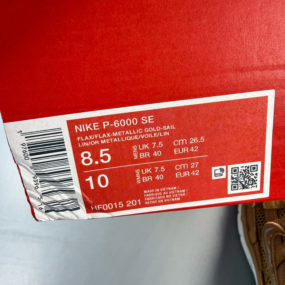 Nike P-6000 SE trainers multi-colour with metallic gold accents and mesh detailing.