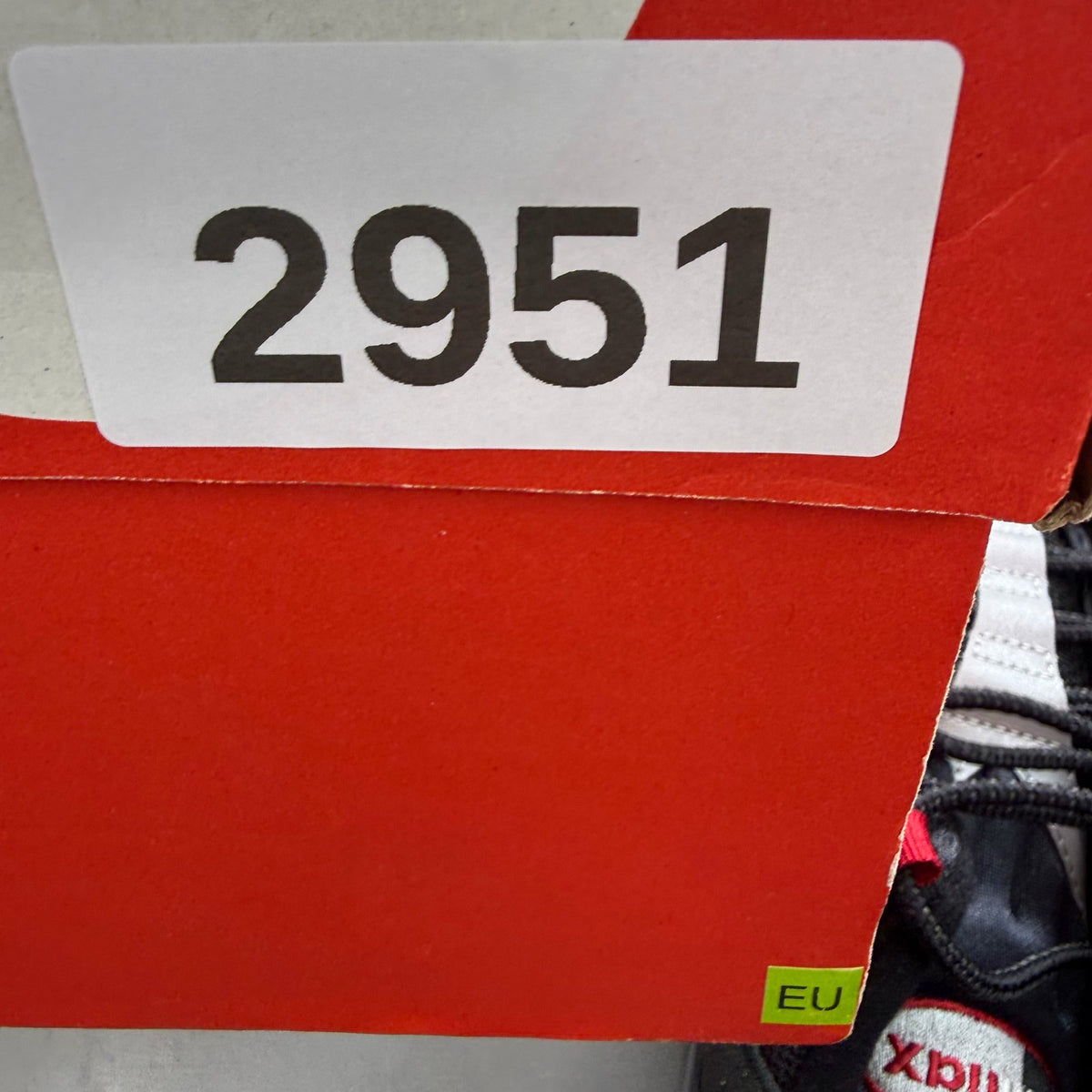 Nike Air Max 95 black trainers with Liverpool FC logo and big bubble sole.