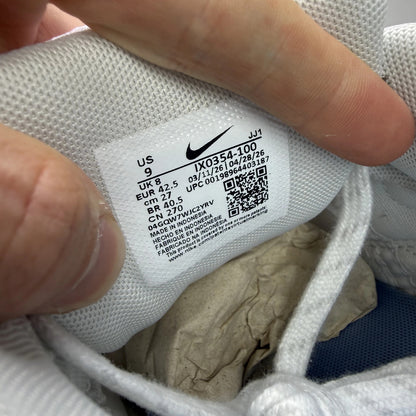 Nike Air Max 90 white trainers with light smoke grey and blue accents, logo on tongue.