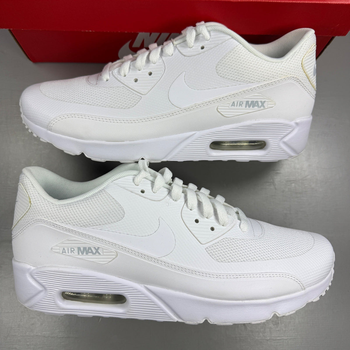 Nike trainers white mesh upper with signature swoosh logo and cushioned sole.