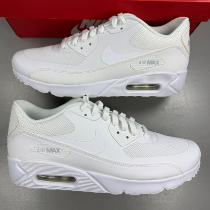 Nike trainers white mesh upper with signature swoosh logo and cushioned sole.