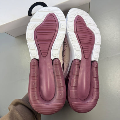 Nike trainers barely rose pink with white accents and Air Max cushioning.