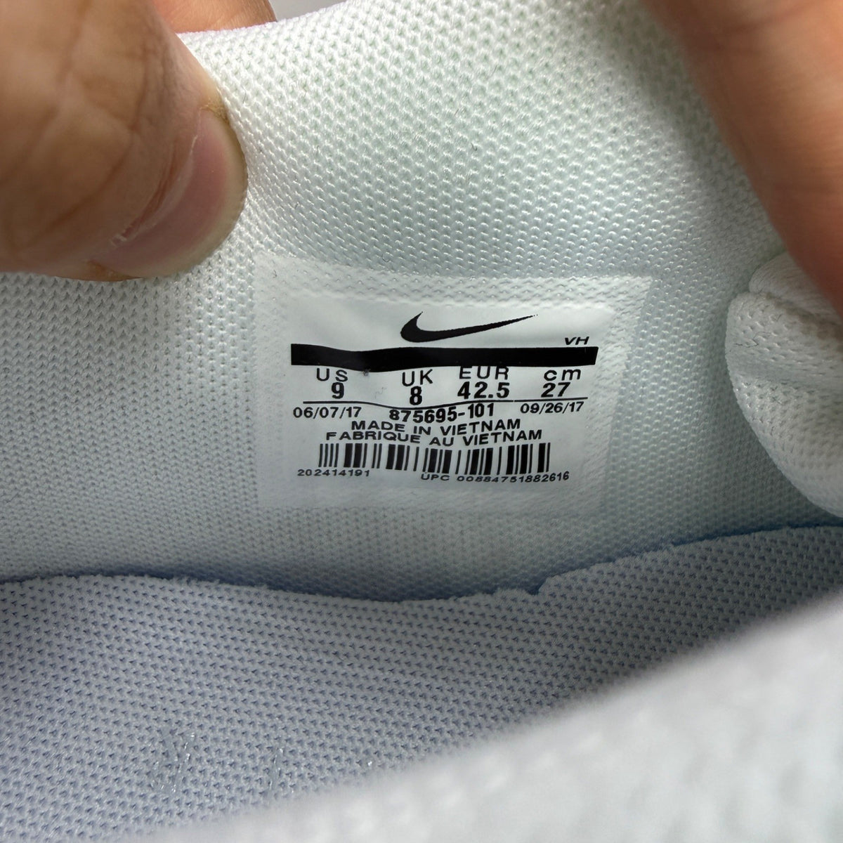 Nike trainers white mesh upper with signature swoosh logo and cushioned sole.