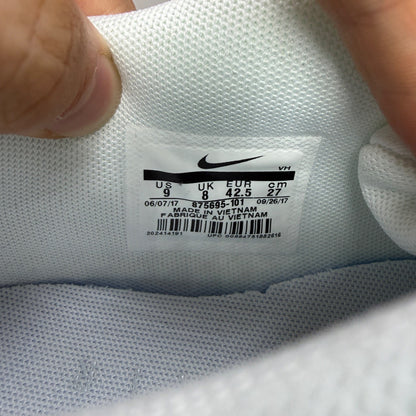 Nike trainers white mesh upper with signature swoosh logo and cushioned sole.