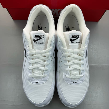 Nike Air Max 90 white trainers with black outlined swoosh logo and mesh material.