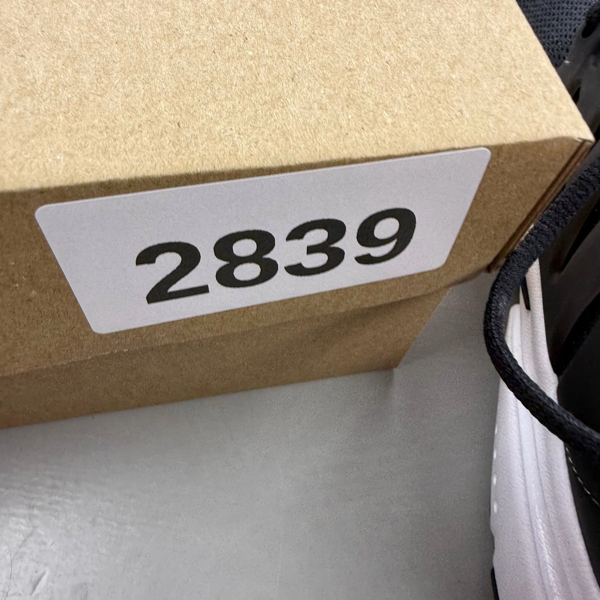 Nike Air Presto black trainers with white accents and breathable mesh upper.