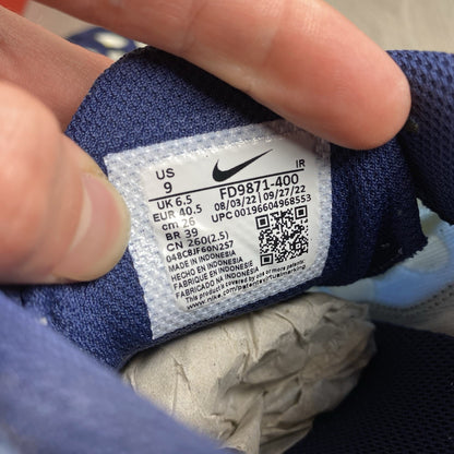 Nike Air Max Plus TN blue trainers with yellow accents and signature swoosh logo.