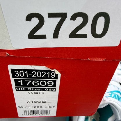 Nike Air Max 90 white trainers with teal accents and visible logo detail.
