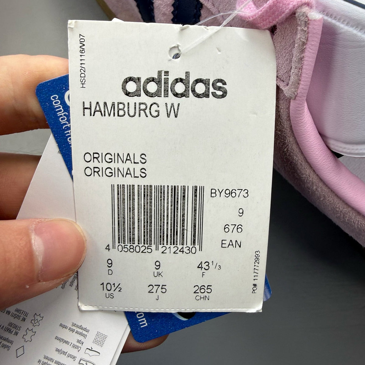 Adidas pink trainers with gum sole, featuring iconic three stripes logo.