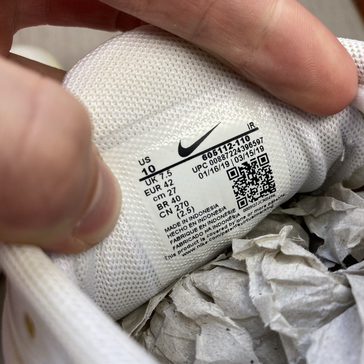 Nike Air Max Plus TN trainers white with silver accents and visible logo.