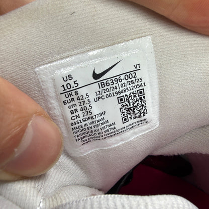 Nike running shoes white with pink accents and visible logo details.
