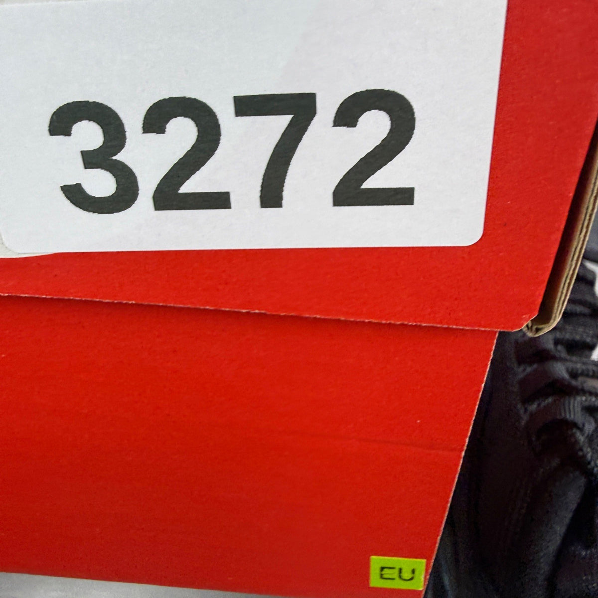 Nike running shoes black with smokey blue accents and visible Air Max cushioning.