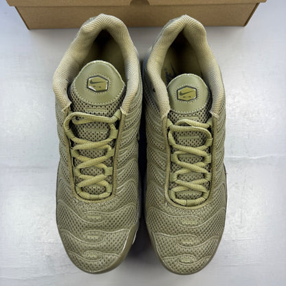 Nike trainers green with Air Max Plus design and signature logo details.