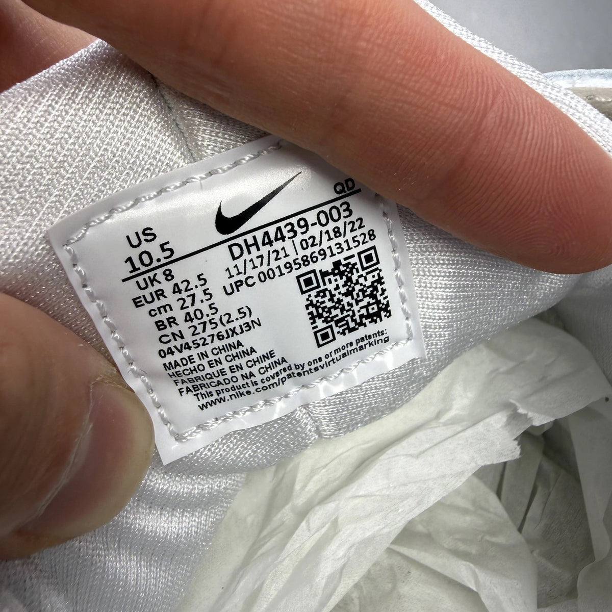 Nike white Air Huarache trainers with gum sole and logo detailing.