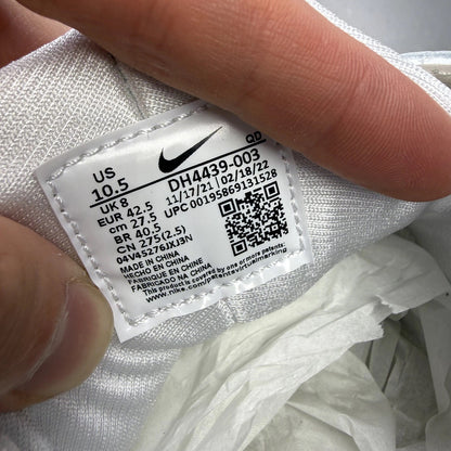 Nike white Air Huarache trainers with gum sole and logo detailing.