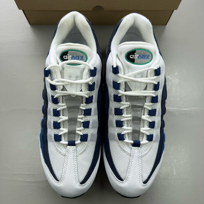 Nike Air Max 95 white trainers with big bubble design and emerald accents.