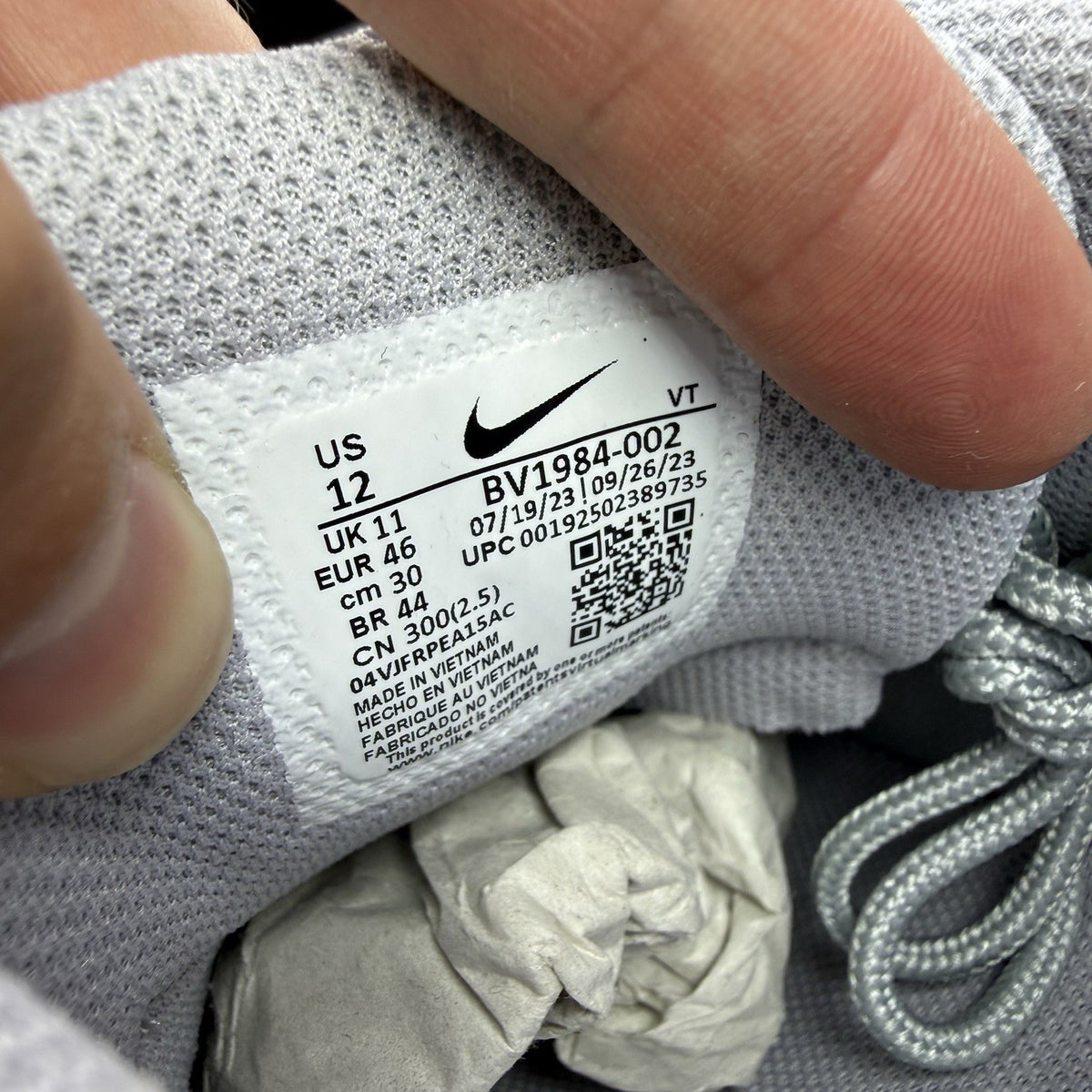 Nike Air Max 95 Ultra grey trainers with black and white accents, mesh and leather material.