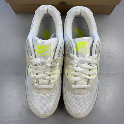 Nike white trainers with lemon venom accents and Air Max logo detail.