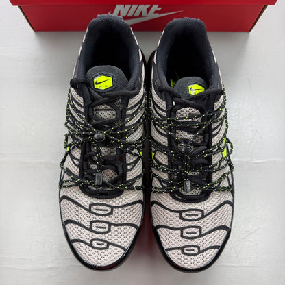Nike Air Max Plus TN black grey volt with signature logo and sleek design.