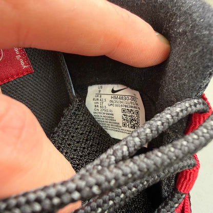 Nike Air Max 95 black trainers with Liverpool FC logo and big bubble sole.