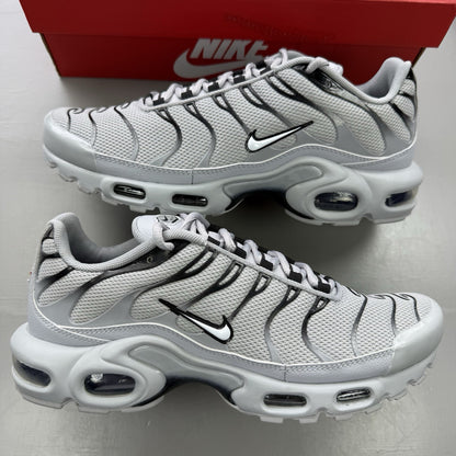 Nike Air Max Plus TN grey trainers mismatched sizes with distinctive logo and sleek design.