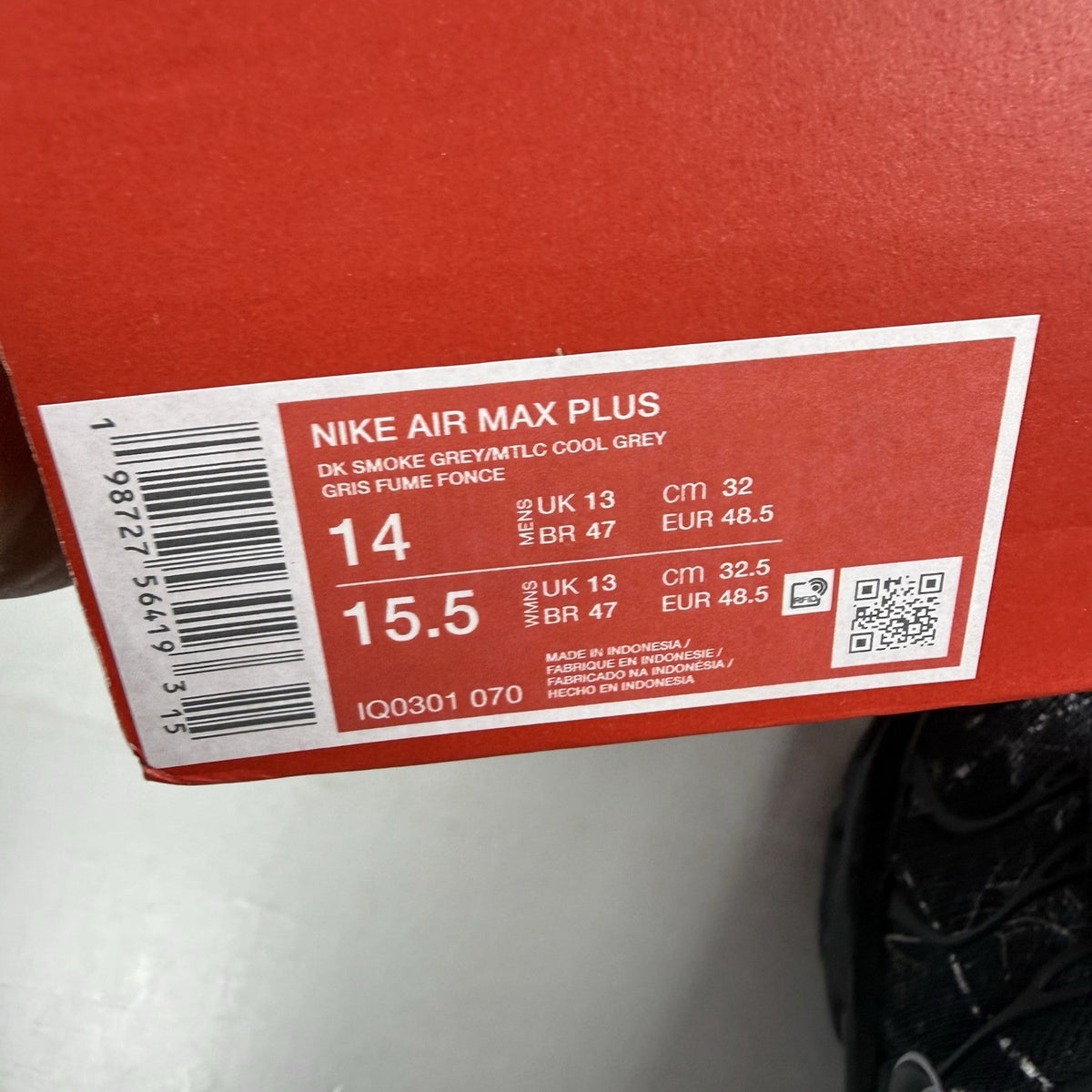 Nike black trainers featuring wood camo pattern and Air Max Plus design.