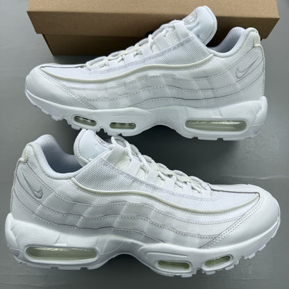 Nike Air Max 95 white trainers with mesh and leather upper, reflective accents.