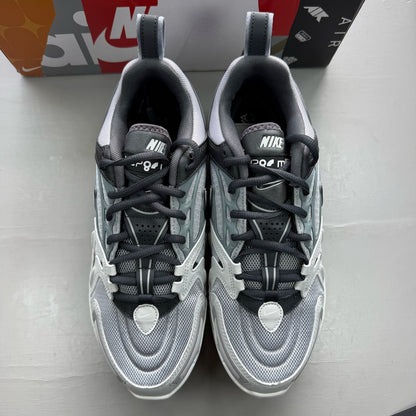 Nike grey trainers with Air cushioning, sleek design, and logo detail.