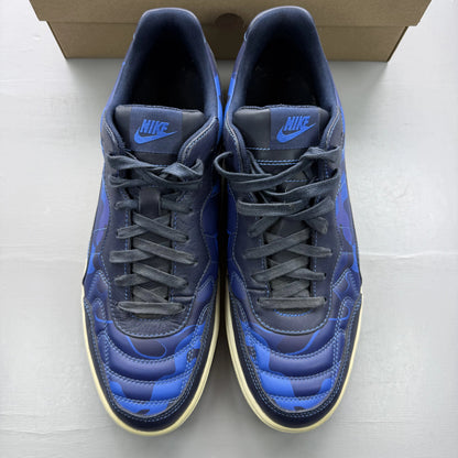 Nike blue trainers with obsidian camo pattern and logo detail.