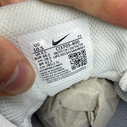 Nike Air Max 95 white trainers with navy accents and signature logo detailing.