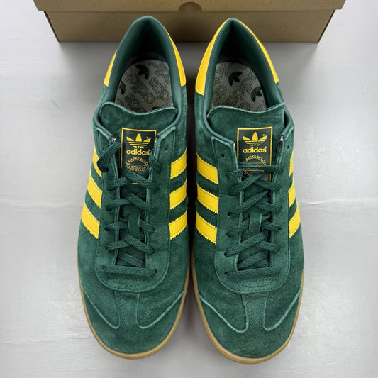 Adidas Hamburg green trainers with gold and yellow accents, featuring classic logo detail.