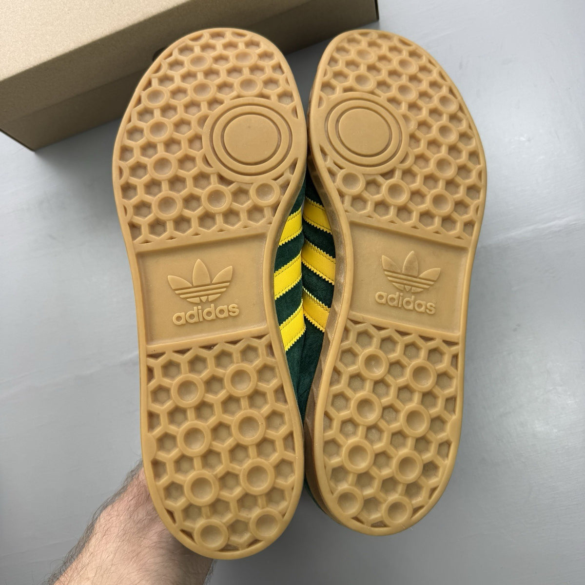 Adidas Hamburg green trainers with gold and yellow accents, featuring classic logo detail.