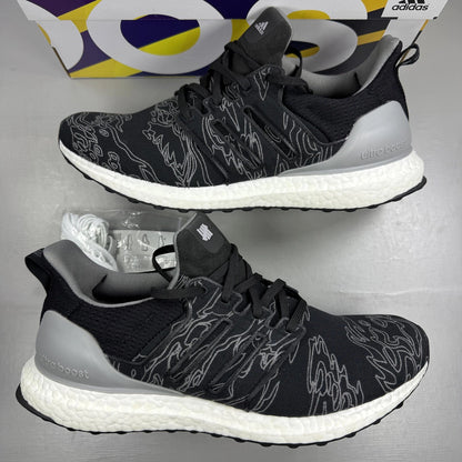 Adidas Ultra Boost black trainers with Undefeated logo and breathable mesh upper.