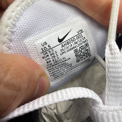 Nike deck shoes white with black accents and logo, featuring a sleek design.