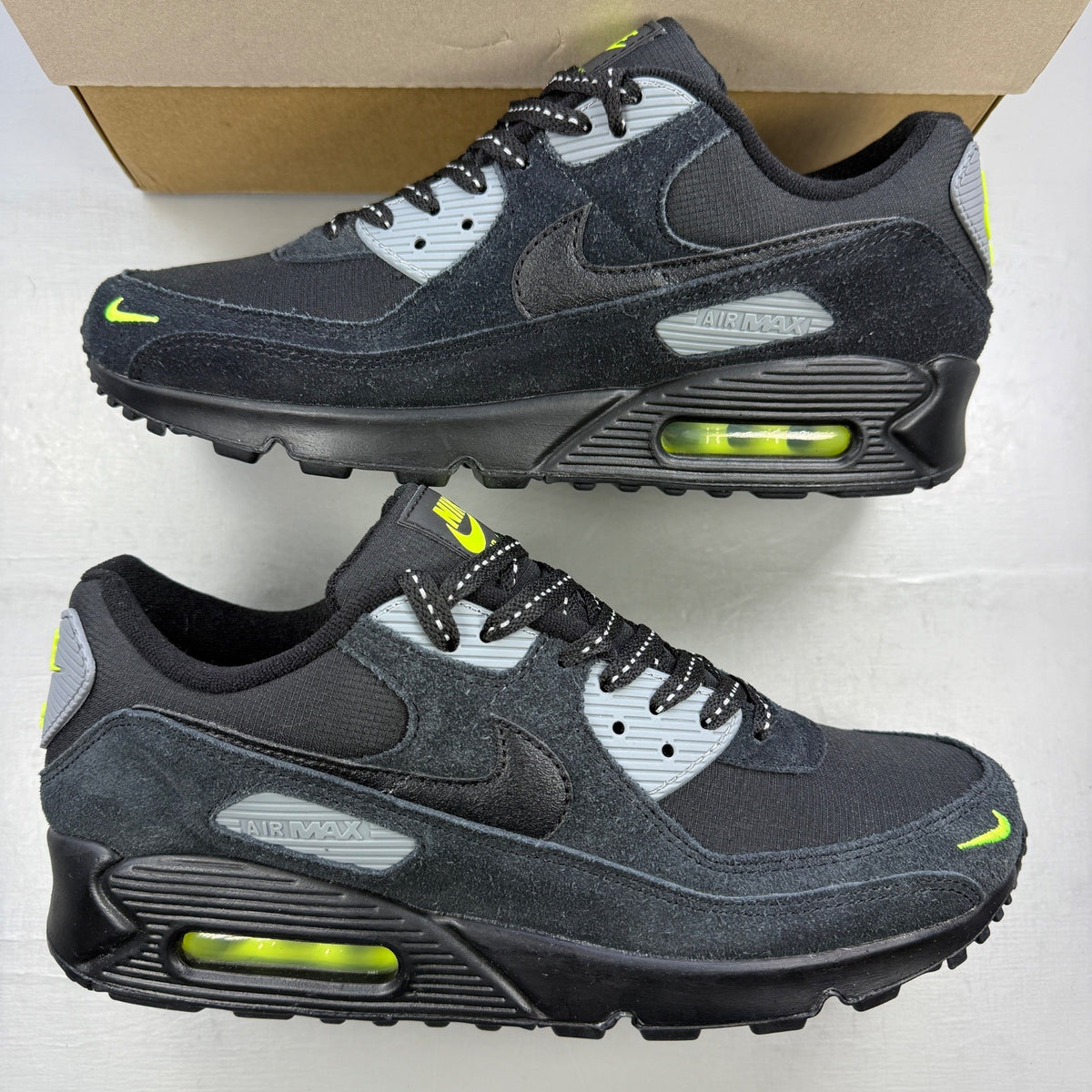 Nike running shoes black with volt accents and mini swoosh logo.