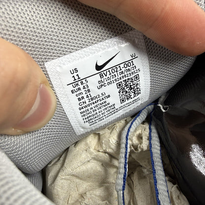 Nike P-6000 trainers white with laser blue and silver accents, mesh material, logo detail.
