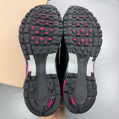 Nike P-6000 trainers black pink metallic detailing and logo accents.
