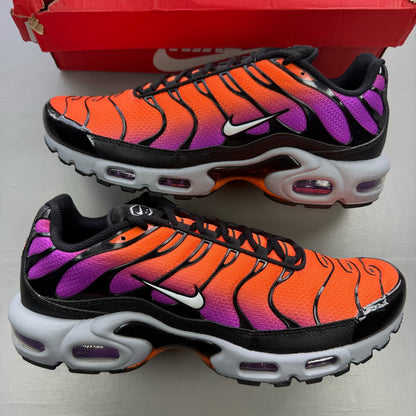 Nike Air Max Plus TN orange trainers with distinctive wave pattern and logo.