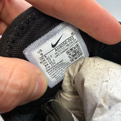 Nike black Air Max 270 trainers with white accents and logo detail.
