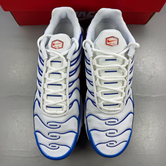 Nike running shoes white with blue accents and signature swoosh logo.