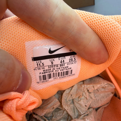 Nike Air Max 90 orange trainers with white and gum sole, featuring iconic logo.
