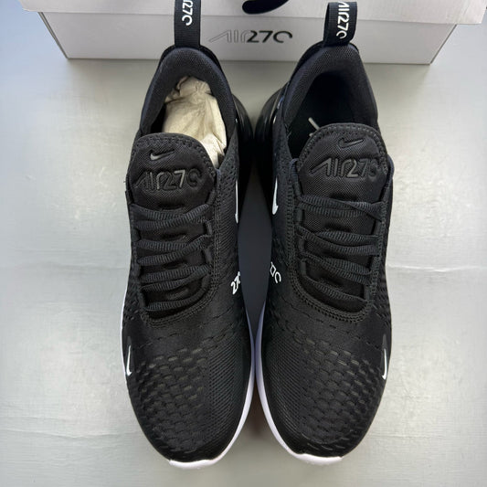 Nike black Air Max 270 trainers with white accents and logo detail.