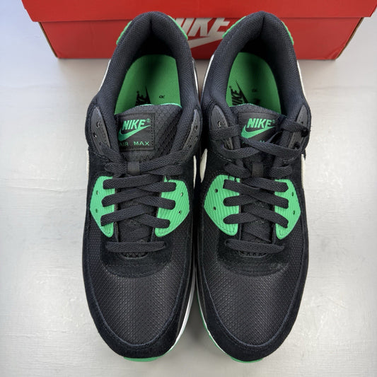 Nike Air Max 90 black trainers with stadium green accents and white sole.