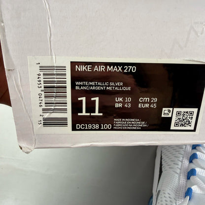 Nike Air Max 270 white trainers with laser blue accents and logo detail.
