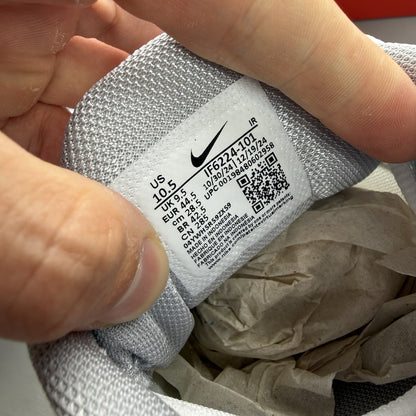 Nike Air Max Plus TN white trainers with university red and grey accents, featuring signature logo.