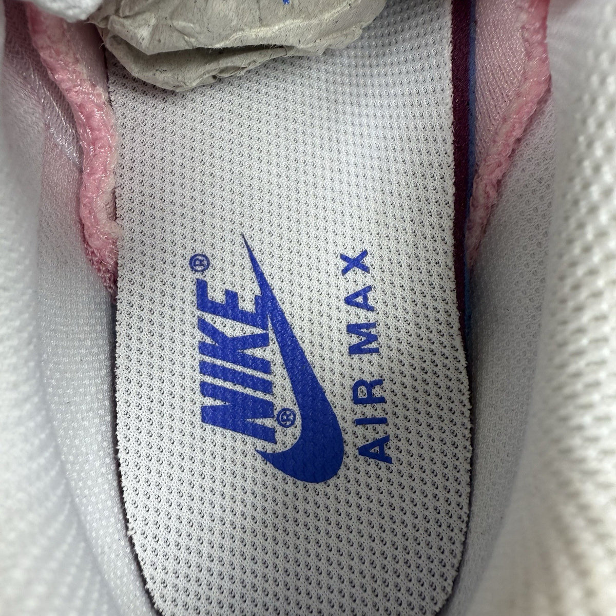 Nike Air Max 95 trainers white with campfire orange accents and signature logo details.
