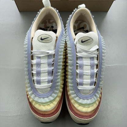 Nike Air Max 97 trainers white with pink accents and beige detailing, authentic design.