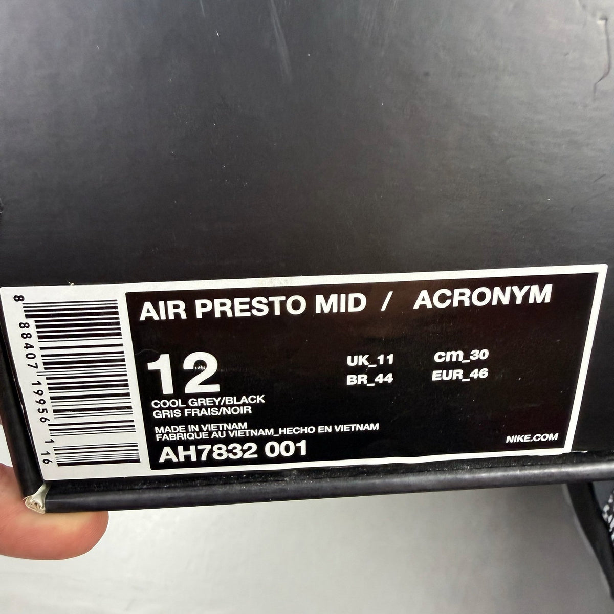 Nike black trainers with Cool Grey accents and Acronym logo details.